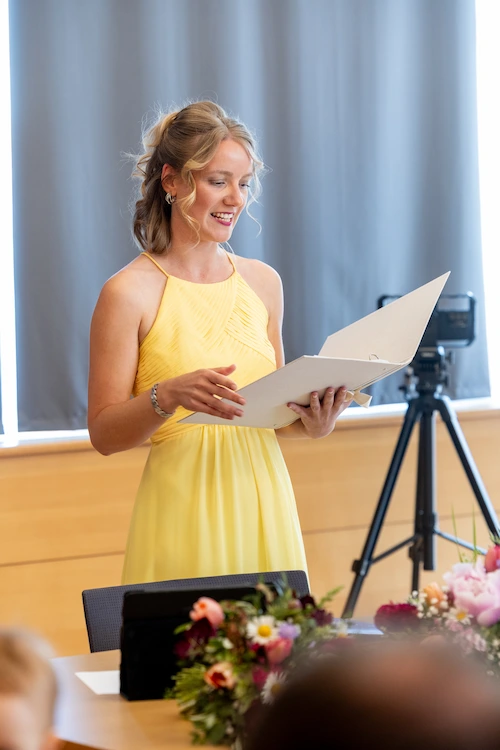 Angie Guttman Wedding Celebrant in a ceremony wearing a yellow shirt